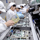 Image for article titled Chinese Factory Workers Fear They May Never Be Replaced With Machines